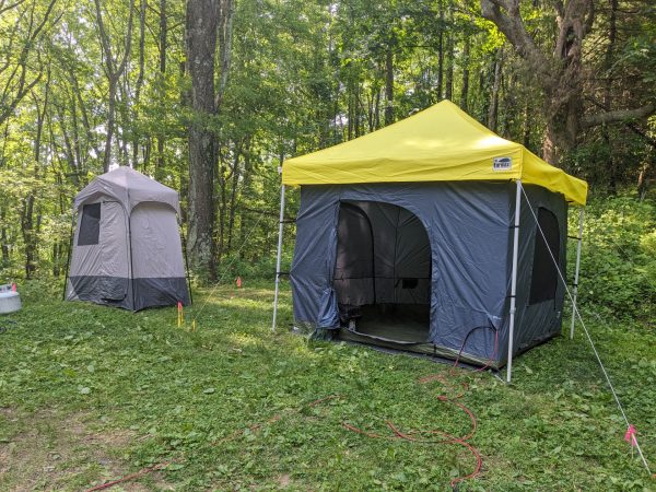 Shelter with one room tent ready to get in
