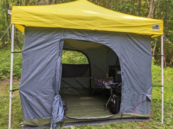 We put up the one room tent with walls under the shelter before the rain came
